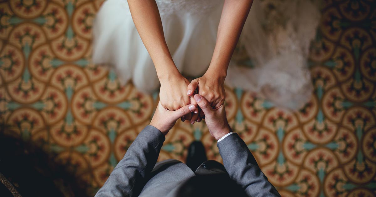 wedding couple holding hands