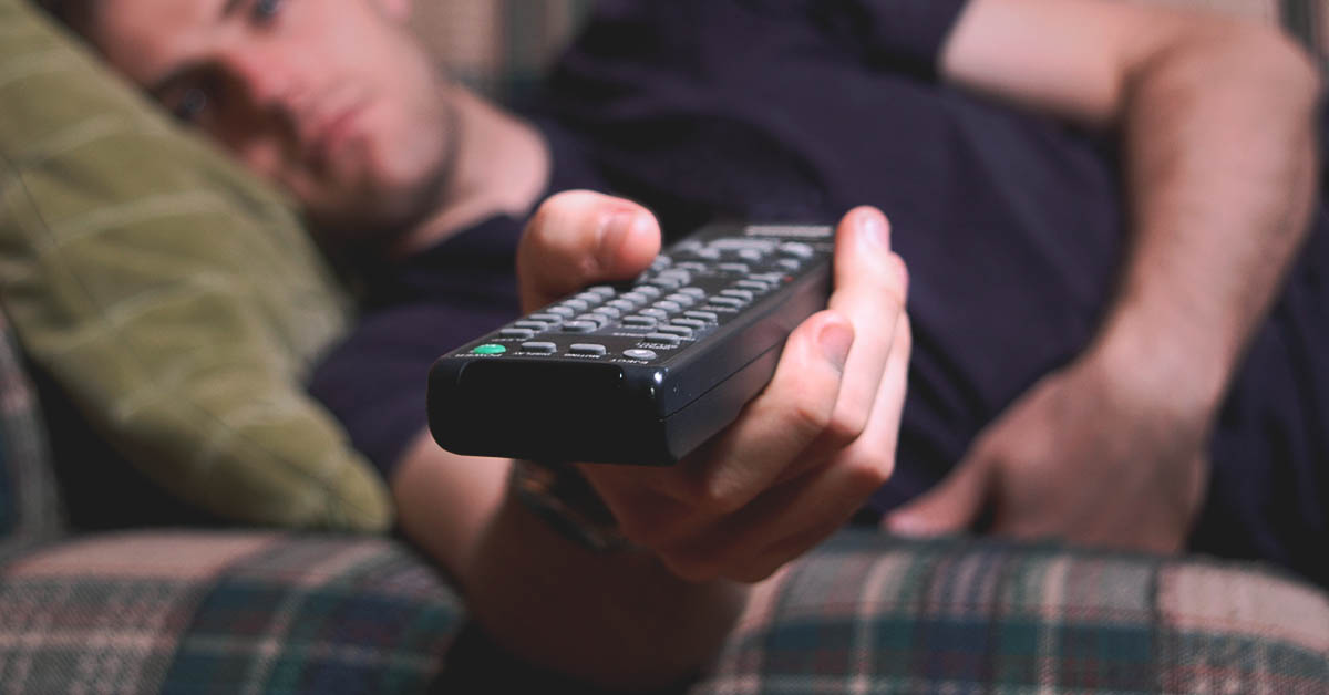 procrastinator on the couch watching tv