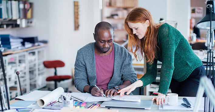 coworkers designing at a desk