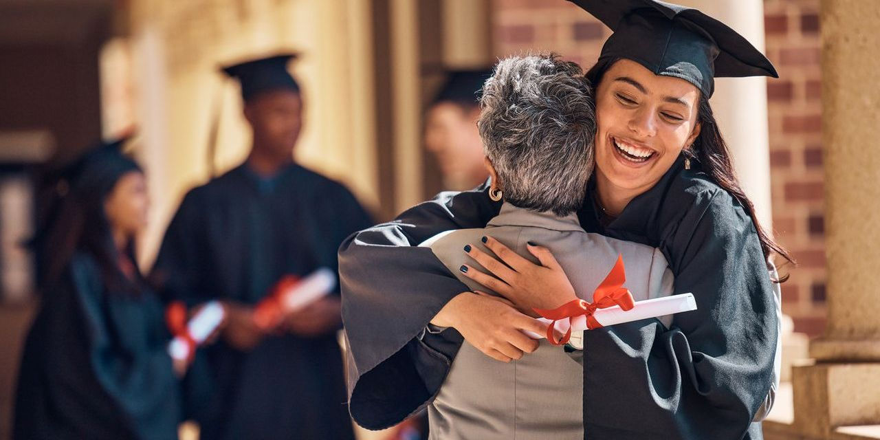 Hug, graduation and graduate, women and education achievement, success on university campus and certificate with academic goals reached. College, student and graduating ceremony, event and degree.