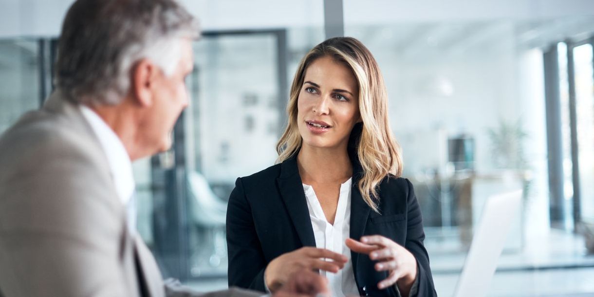 Female financial professional presenting to a male colleague