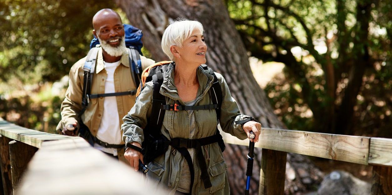 Senior couple enjoying themselves on their hike in the woods